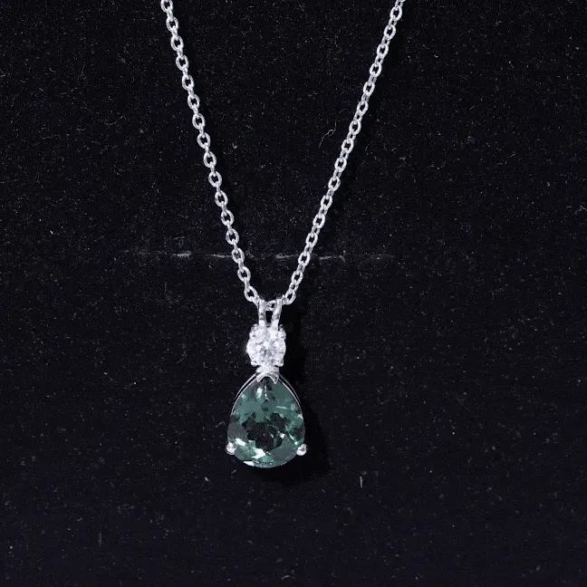 Pear Cut Created Green Sapphire Drop Pendant with Moissanite