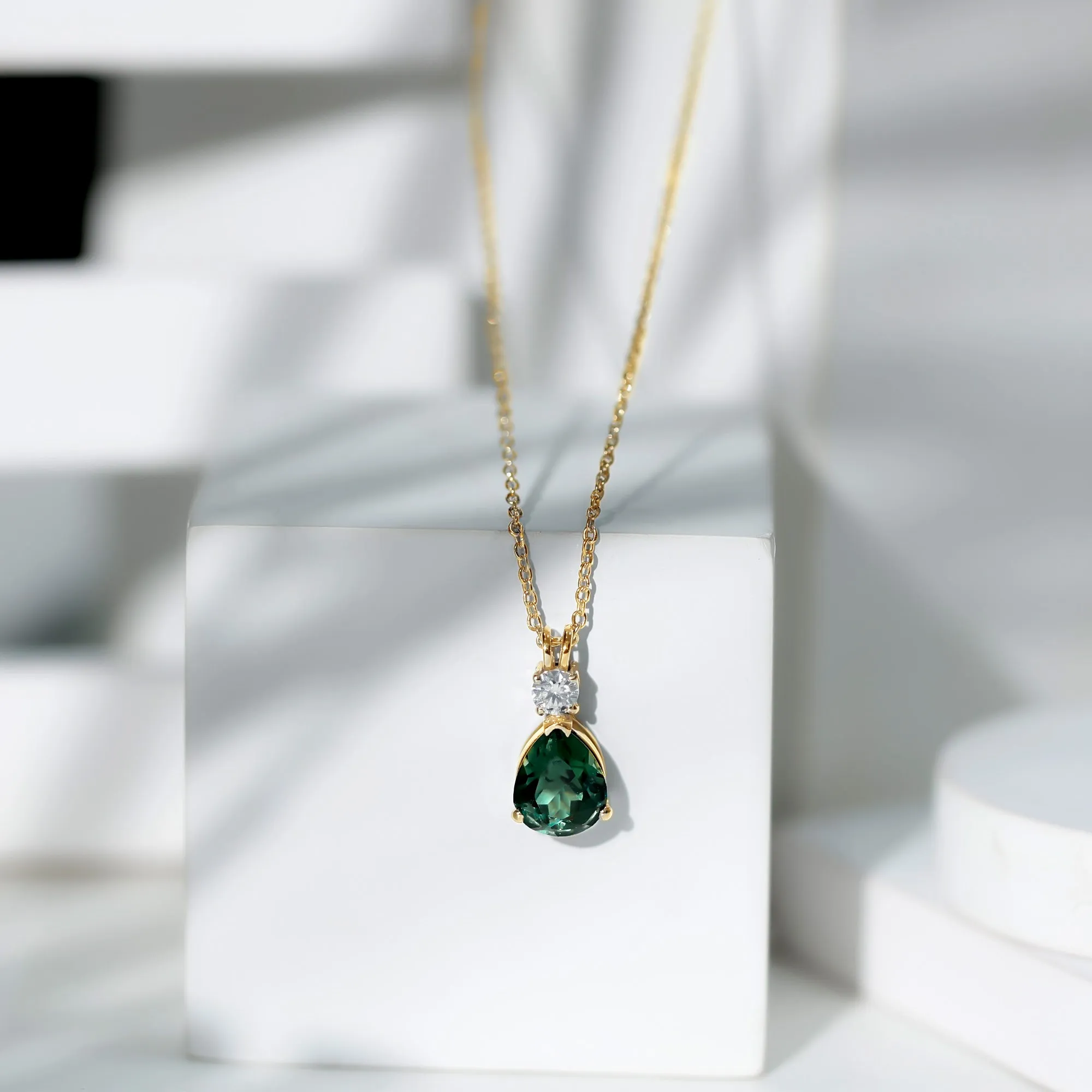 Pear Cut Created Green Sapphire Drop Pendant with Moissanite