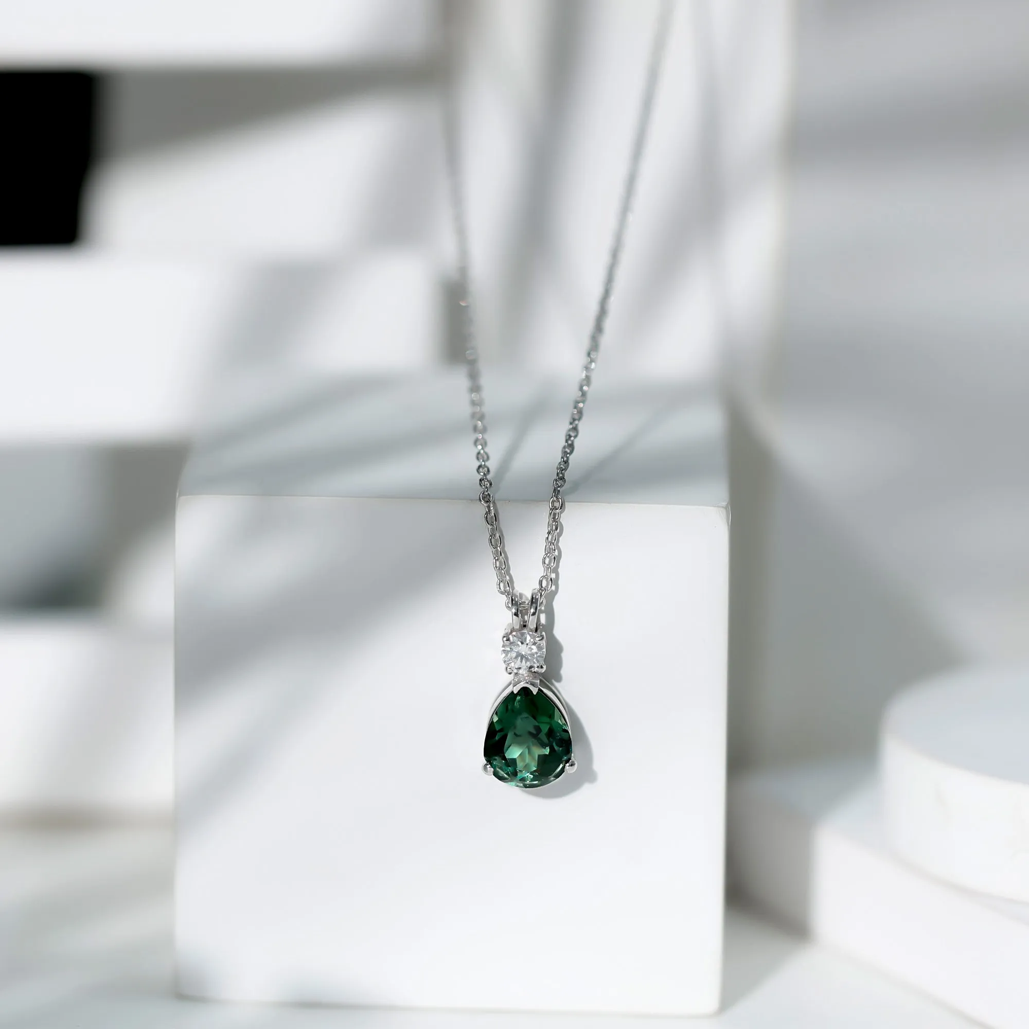Pear Cut Created Green Sapphire Drop Pendant with Moissanite