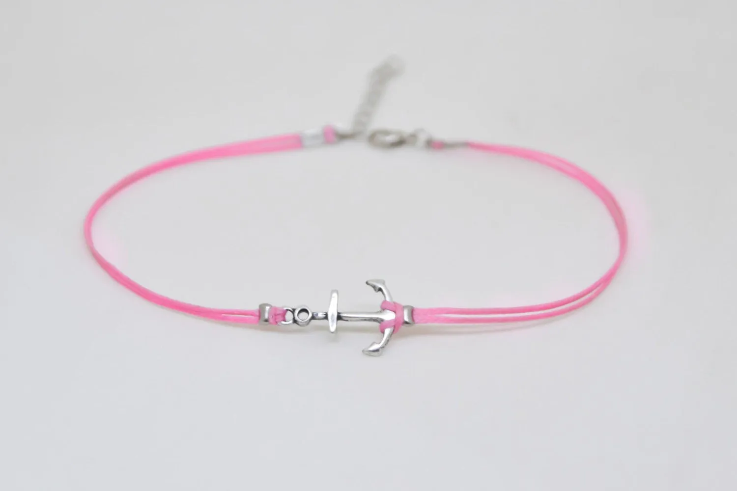 Pink dainty anklet with a silver anchor charm, nautical jewelry